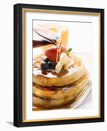 Pouring Maple Syrup over Waffles with Butter and Berries-null-Framed Photographic Print