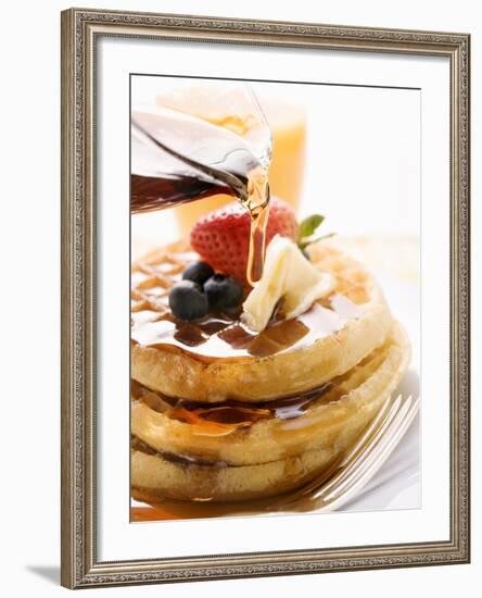 Pouring Maple Syrup over Waffles with Butter and Berries-null-Framed Photographic Print