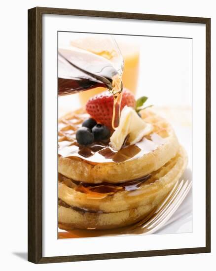 Pouring Maple Syrup over Waffles with Butter and Berries-null-Framed Photographic Print