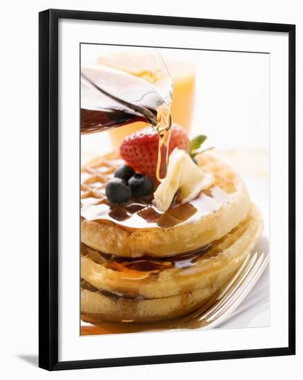 Pouring Maple Syrup over Waffles with Butter and Berries-null-Framed Photographic Print