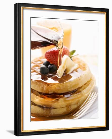 Pouring Maple Syrup over Waffles with Butter and Berries-null-Framed Photographic Print