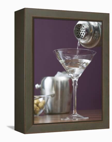 Pouring Martini Out of Cocktail Shaker into Glass-null-Framed Premier Image Canvas