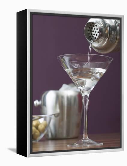 Pouring Martini Out of Cocktail Shaker into Glass-null-Framed Premier Image Canvas