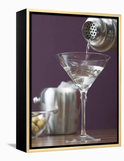 Pouring Martini Out of Cocktail Shaker into Glass-null-Framed Premier Image Canvas