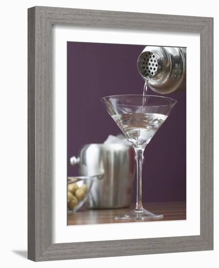 Pouring Martini Out of Cocktail Shaker into Glass-null-Framed Photographic Print