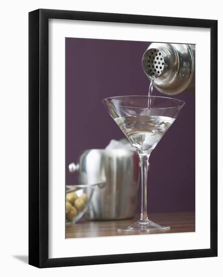 Pouring Martini Out of Cocktail Shaker into Glass-null-Framed Photographic Print