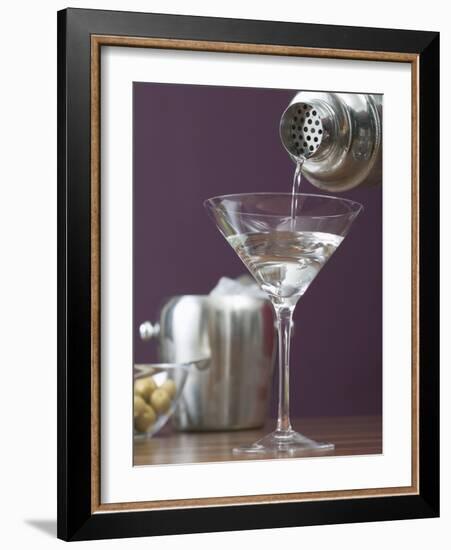 Pouring Martini Out of Cocktail Shaker into Glass-null-Framed Photographic Print