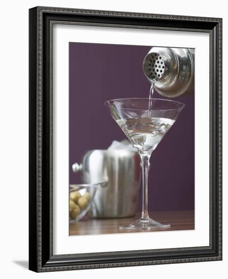 Pouring Martini Out of Cocktail Shaker into Glass-null-Framed Photographic Print