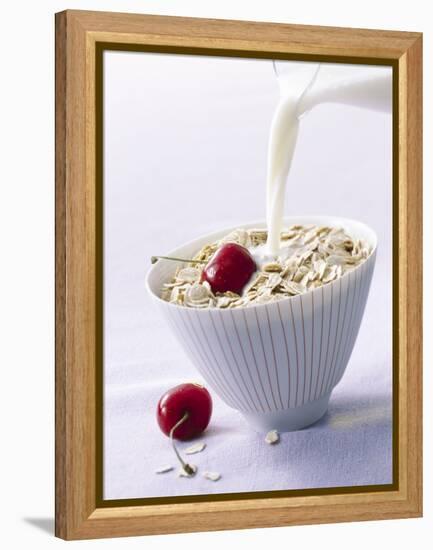 Pouring Milk onto Oat Flakes-null-Framed Premier Image Canvas