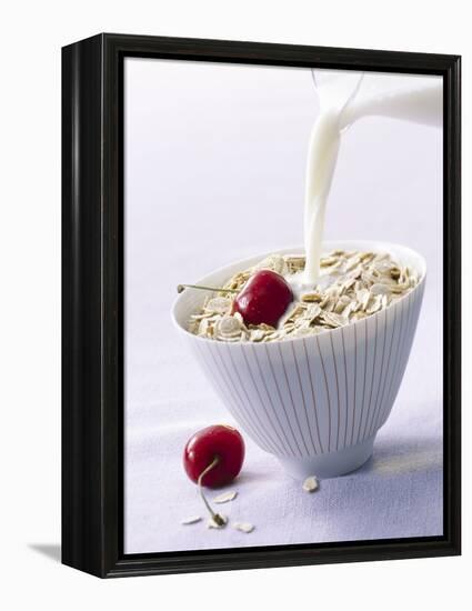 Pouring Milk onto Oat Flakes-null-Framed Premier Image Canvas