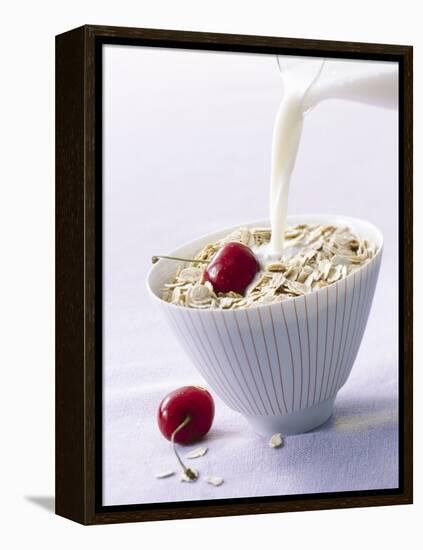 Pouring Milk onto Oat Flakes-null-Framed Premier Image Canvas