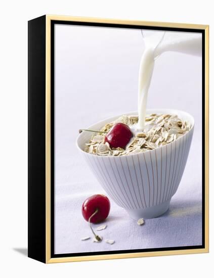 Pouring Milk onto Oat Flakes-null-Framed Premier Image Canvas