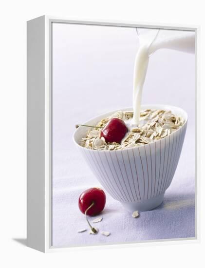 Pouring Milk onto Oat Flakes-null-Framed Premier Image Canvas