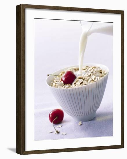 Pouring Milk onto Oat Flakes-null-Framed Photographic Print