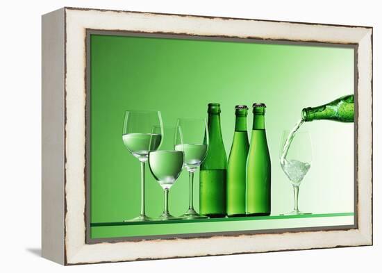 Pouring Mineral Water into Glass-Klaus Arras-Framed Premier Image Canvas