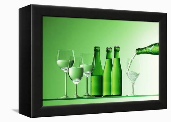 Pouring Mineral Water into Glass-Klaus Arras-Framed Premier Image Canvas