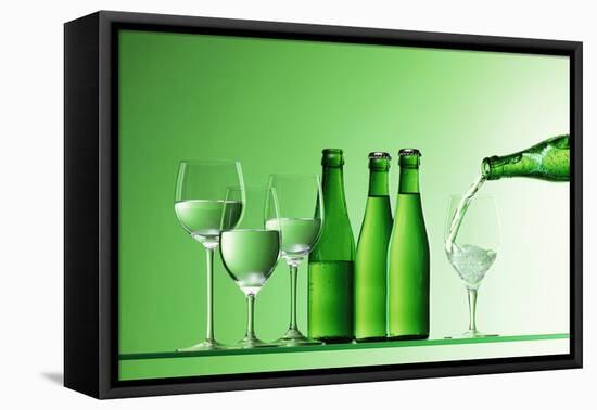 Pouring Mineral Water into Glass-Klaus Arras-Framed Premier Image Canvas