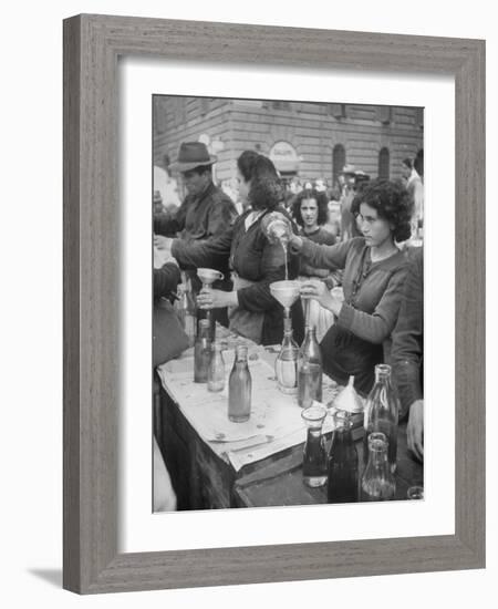 Pouring Olive Oil in Buyers' Bottles in Black Market-Alfred Eisenstaedt-Framed Photographic Print