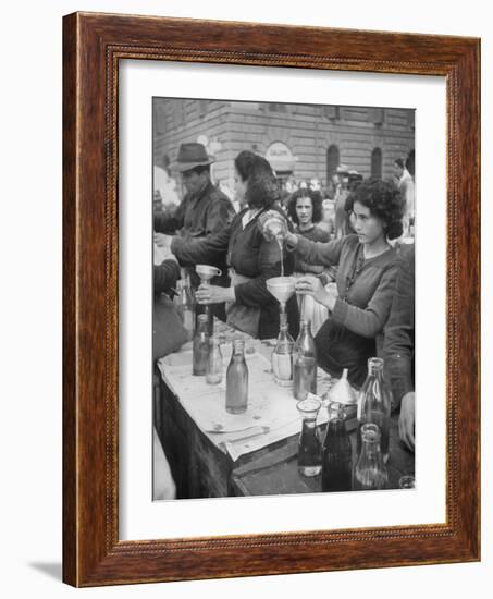 Pouring Olive Oil in Buyers' Bottles in Black Market-Alfred Eisenstaedt-Framed Photographic Print