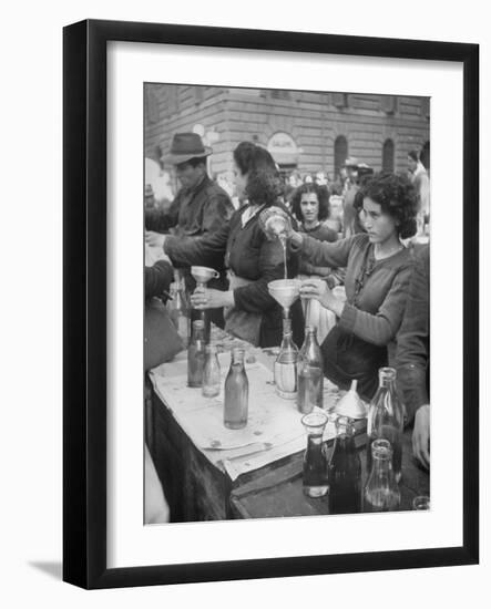 Pouring Olive Oil in Buyers' Bottles in Black Market-Alfred Eisenstaedt-Framed Photographic Print