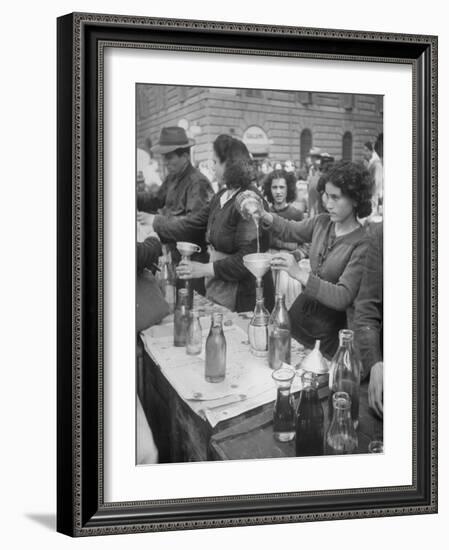 Pouring Olive Oil in Buyers' Bottles in Black Market-Alfred Eisenstaedt-Framed Photographic Print