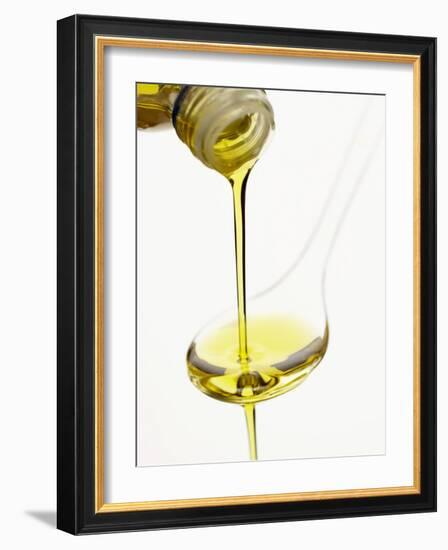 Pouring Olive Oil Over a Spoon-Marc O^ Finley-Framed Photographic Print