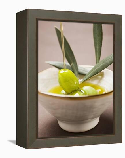 Pouring Olive Oil Over Olive Sprig with Green Olives-null-Framed Premier Image Canvas