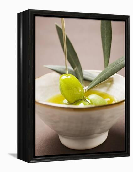 Pouring Olive Oil Over Olive Sprig with Green Olives-null-Framed Premier Image Canvas