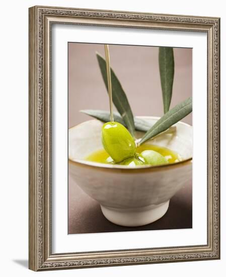 Pouring Olive Oil Over Olive Sprig with Green Olives-null-Framed Photographic Print