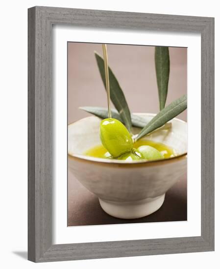 Pouring Olive Oil Over Olive Sprig with Green Olives-null-Framed Photographic Print