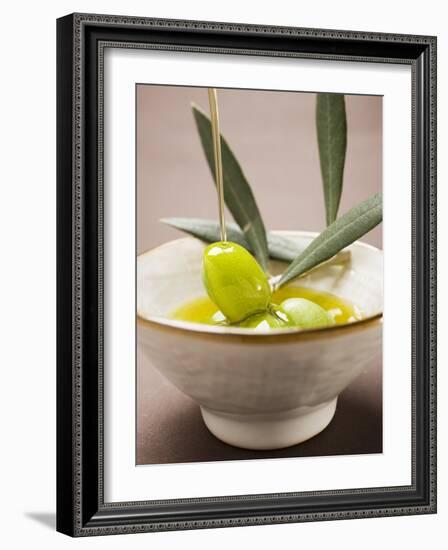 Pouring Olive Oil Over Olive Sprig with Green Olives-null-Framed Photographic Print