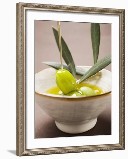 Pouring Olive Oil Over Olive Sprig with Green Olives-null-Framed Photographic Print