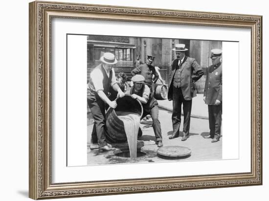 Pouring Out Illegal Alcohol into a Sewer-null-Framed Art Print