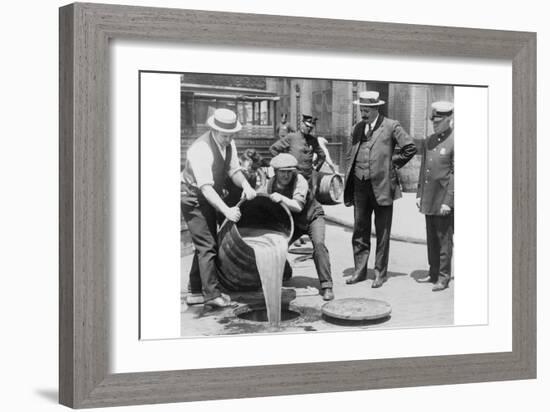 Pouring Out Illegal Alcohol into a Sewer-null-Framed Art Print