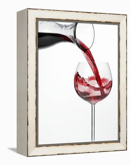 Pouring Red Wine into Glass from Carafe-Kröger & Gross-Framed Premier Image Canvas