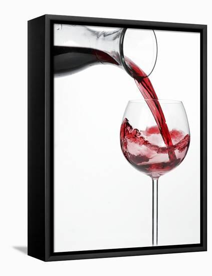 Pouring Red Wine into Glass from Carafe-Kröger & Gross-Framed Premier Image Canvas