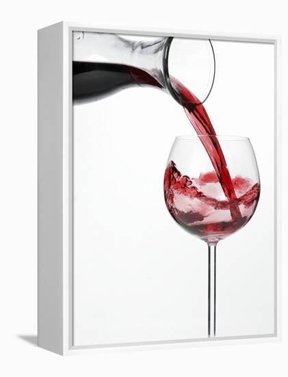 Pouring Red Wine into Glass from Carafe-Kröger & Gross-Framed Premier Image Canvas