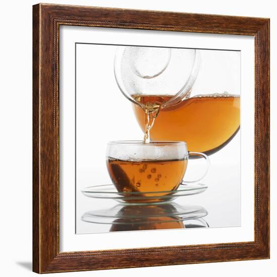 Pouring Tea into a Glass Cup-Alexander Feig-Framed Photographic Print