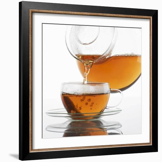 Pouring Tea into a Glass Cup-Alexander Feig-Framed Photographic Print