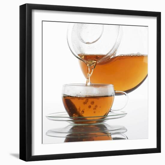 Pouring Tea into a Glass Cup-Alexander Feig-Framed Photographic Print