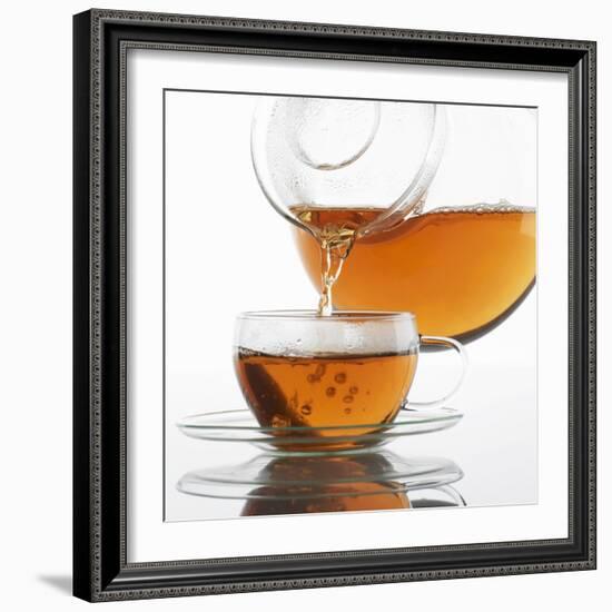 Pouring Tea into a Glass Cup-Alexander Feig-Framed Photographic Print