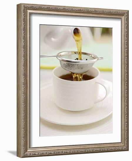 Pouring Tea Through a Tea Strainer-Winfried Heinze-Framed Photographic Print