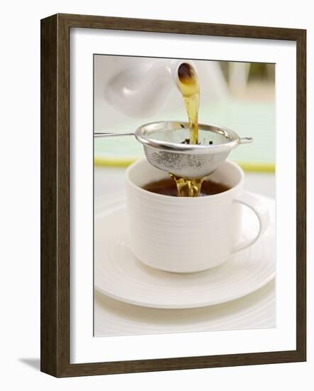 Pouring Tea Through a Tea Strainer-Winfried Heinze-Framed Photographic Print