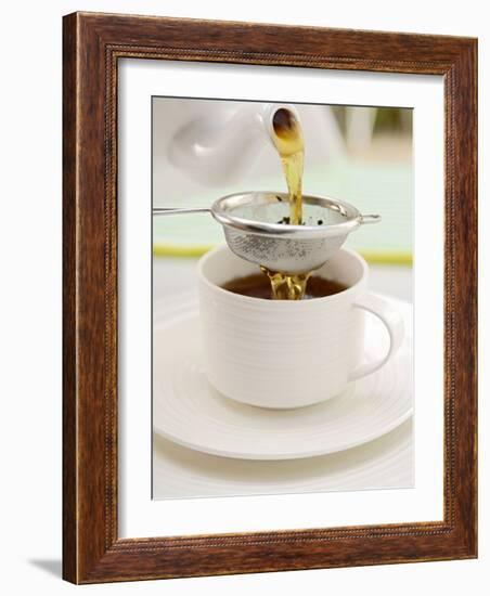 Pouring Tea Through a Tea Strainer-Winfried Heinze-Framed Photographic Print