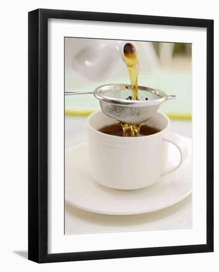 Pouring Tea Through a Tea Strainer-Winfried Heinze-Framed Photographic Print