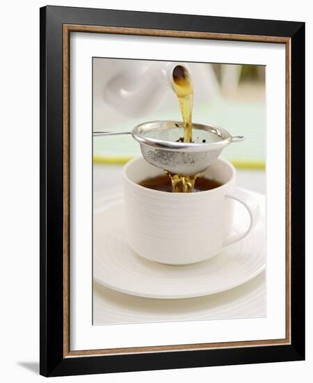 Pouring Tea Through a Tea Strainer-Winfried Heinze-Framed Photographic Print