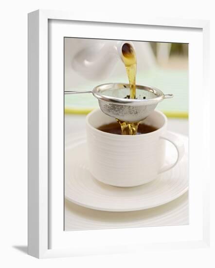 Pouring Tea Through a Tea Strainer-Winfried Heinze-Framed Photographic Print