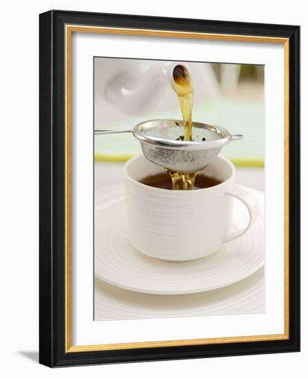 Pouring Tea Through a Tea Strainer-Winfried Heinze-Framed Photographic Print