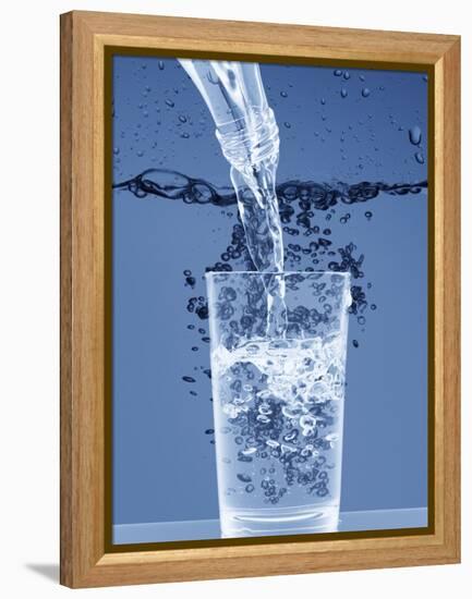 Pouring Water from a Bottle into a Glass-Petr Gross-Framed Premier Image Canvas