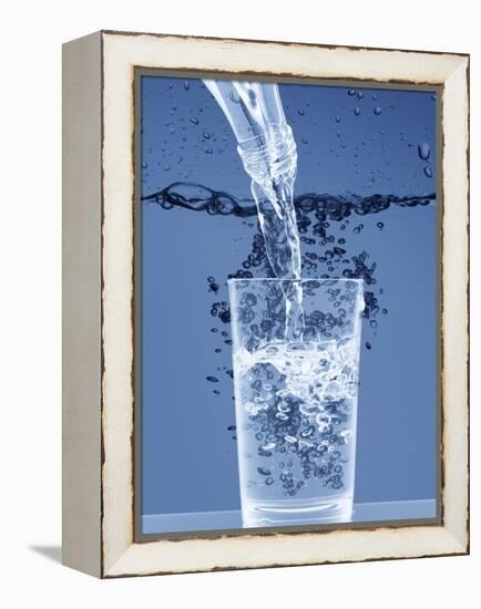 Pouring Water from a Bottle into a Glass-Petr Gross-Framed Premier Image Canvas